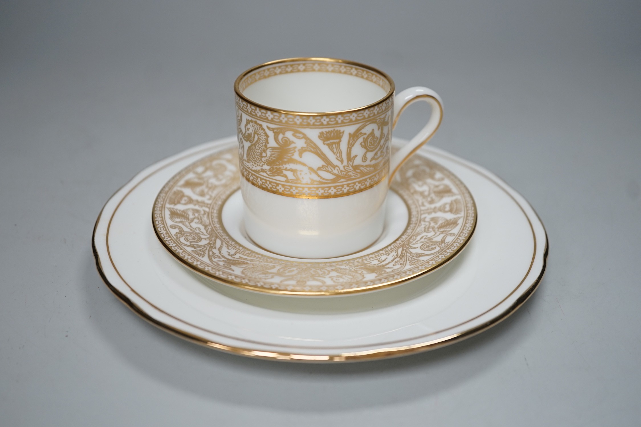 A Victorian Wedgwood part dinner service, with black printed classical borders, together with two Minton meat dishes and a Wedgwood gilt bordered coffee service.